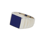Load image into Gallery viewer, A sterling silver signet ring with a blue lapis gemstone on a white surface.