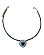 Load image into Gallery viewer, Necklace with a heart-shaped pendant on a light gray background