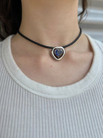 Load image into Gallery viewer, Necklace with a heart-shaped pendant worn by a person