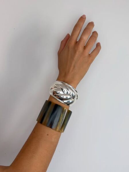 Two cuffs stacked on one wrist
