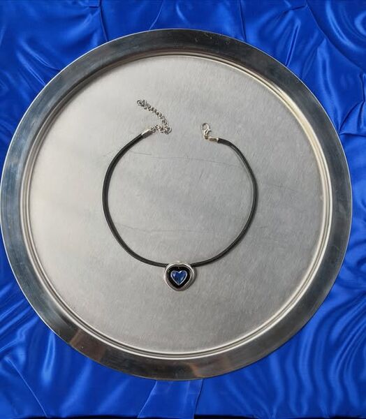 A heart choker on a silver tray